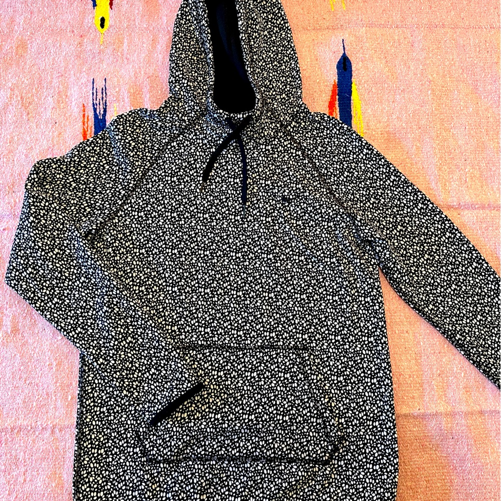 Nike THERMA-FIT hooded sweatshirt.